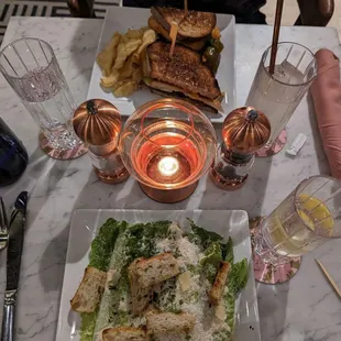Chicken club sandwich and the Caesar salad.