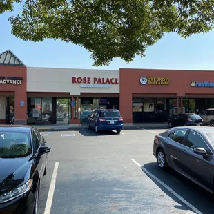 a parking lot with cars parked in front of it