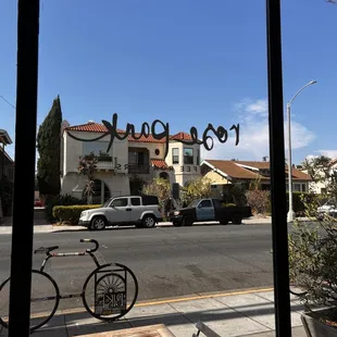 a bicycle parked in front of the window