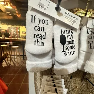 a display of wine related towels