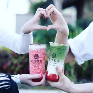 two people making a heart with their hands