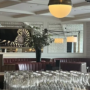 a bar with wine glasses