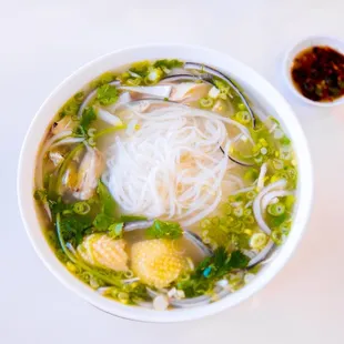 a bowl of soup with noodles and meat