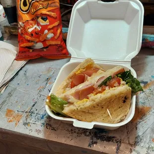 Freshly baked artisan bread sandwich with shaved ham.