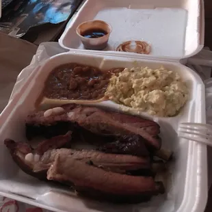 Ribs, burger baked beans and potato salad