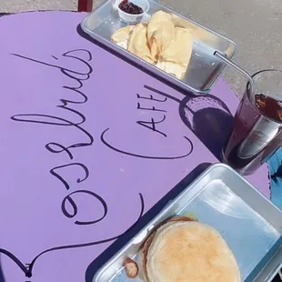 a table with a sandwich and fries