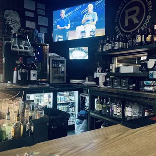 a bar with a large screen tv