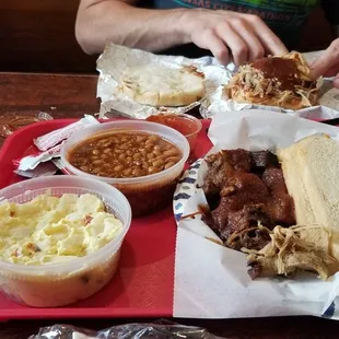 Burt End plate and pulled pork sandwich w potato salad and bbq beans