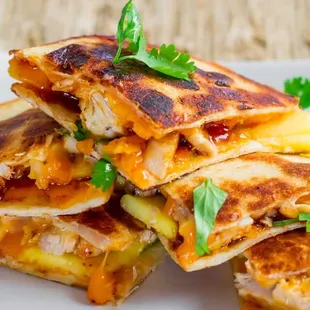 a stack of quesadillas on a plate