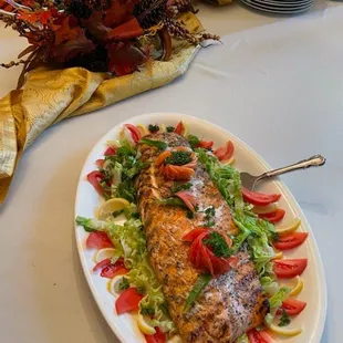 a plate of salmon and vegetables