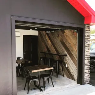 Garage door goes up on nice days! We have a custom epoxy bar top against our focal barn wood wall.