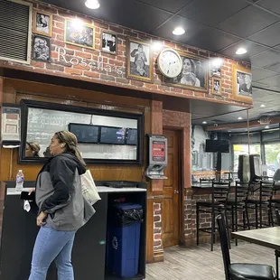 a woman standing in a restaurant