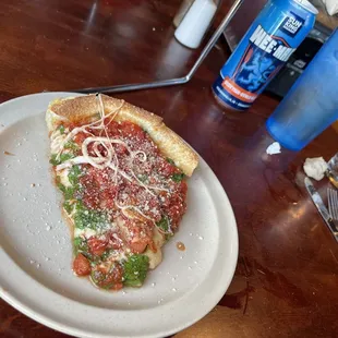 a slice of pizza on a plate