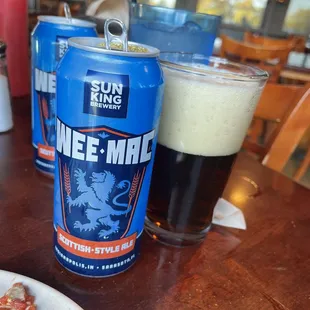 a beer and a slice of pizza