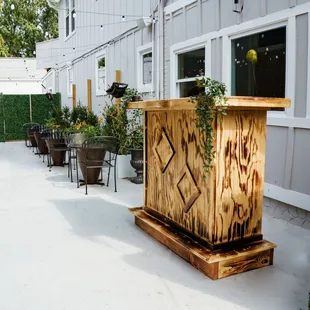 a wooden planter on a patio