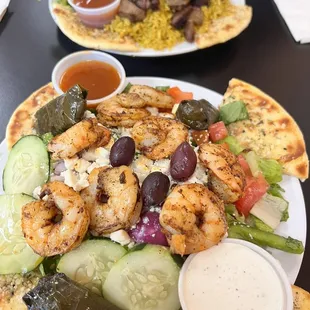 This is Rosemary Grills FAMOUS Greek salad with grilled shrimp. I added a side order of grape leaves.