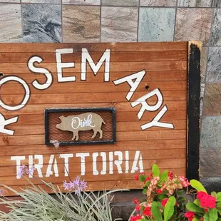 a sign for rosemary trattoria