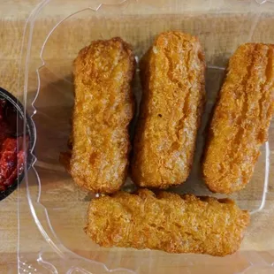 Fried mozzarella sticks with marinara sauce