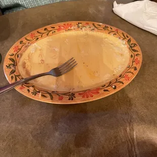 This is what a plate of enchiladas looks like when licked clean with a fork.