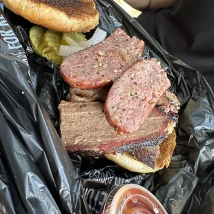 Brisket sandwich with sausage.