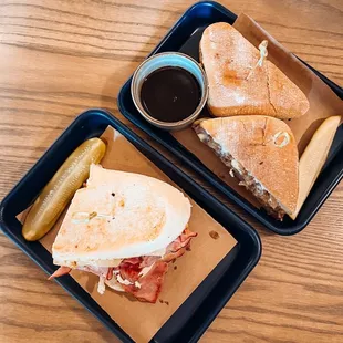two trays of sandwiches