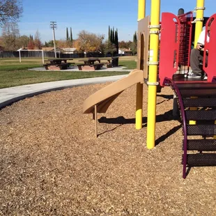 Picnic tables and grill close to play ground