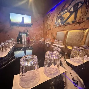 a long table with wine glasses on it