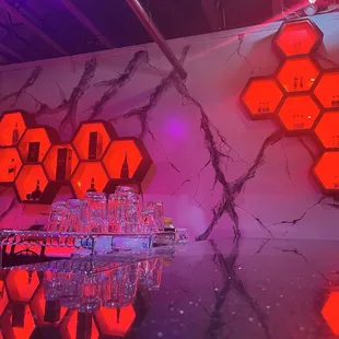 a bar with neon lights and a bar counter
