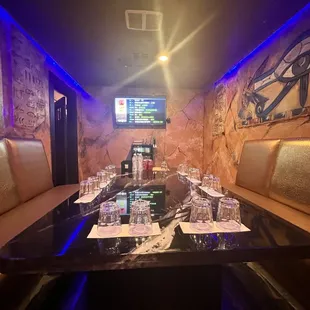 a long table with wine glasses on it