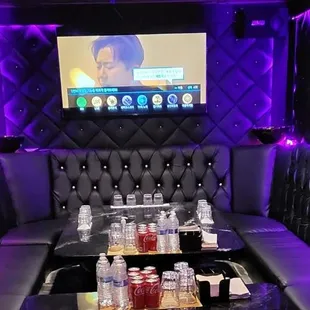 a black booth with purple lighting