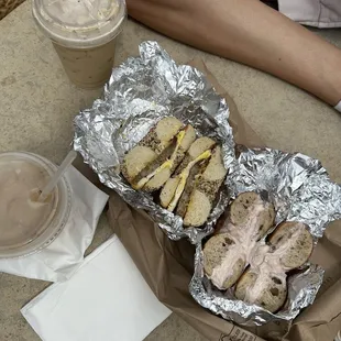 Breakfast sandwich on everything w sausage, cinnamon raisin with blueberry cream cheese