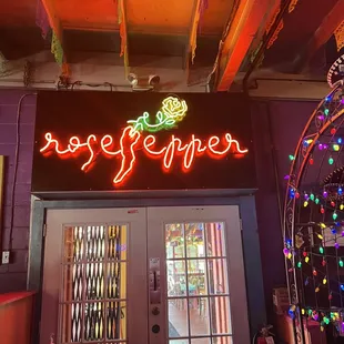 neon sign above door