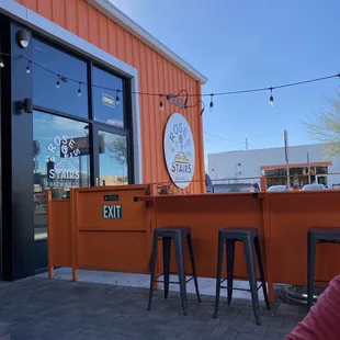 a man sitting at a table outside