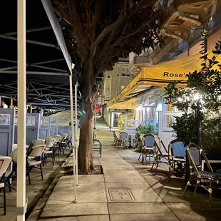 tables and chairs outside at night
