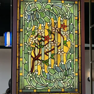 Gorgeous details in the decor! Beautiful stained glass window behind the bar.