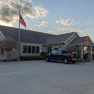 a truck parked in front of the restaurant