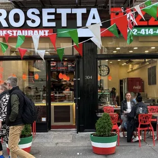 people sitting outside a restaurant