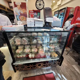 a display case of cupcakes