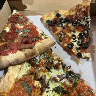 three slices of pizza in a box