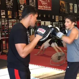 Coach Abe holding mitts