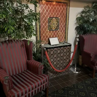 red striped chairs and a red carpet