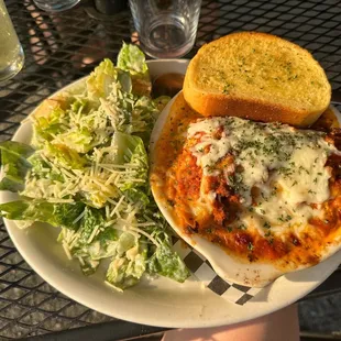 Classic Lasagna, caesar salad, garlic bread