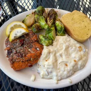 Wild Alaskan Sockey Salmon encrusted in honey &amp; toasted pecans, garlic mashed potatoes, brussel sprouts, garlic bread.