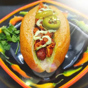 Rosey's AZ Dog - Pancetta wrapped with cilantro aïoli and pickled jalapeños