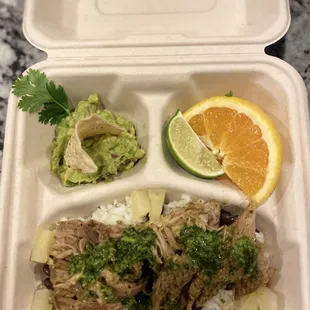 Cuban Mojo Pork - Explosion of citrus flavors served with rice, black beans &amp; side of fresh guacamole,