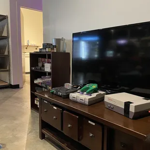 a man sitting in front of a television