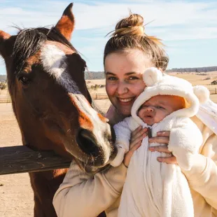 Guest showing baby the horse