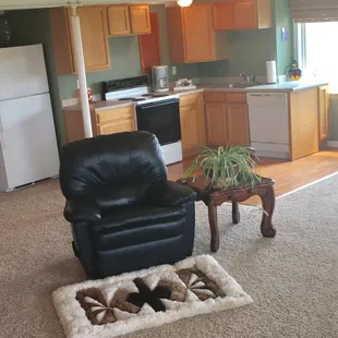 Living room kitchen inside rental unit