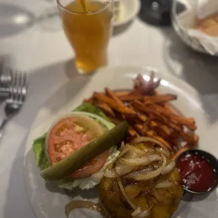 Cheddar cheese with sautéed onions sweet potato fries and Blue Moon beer( Rosie O&apos;grady&apos;s Burger)