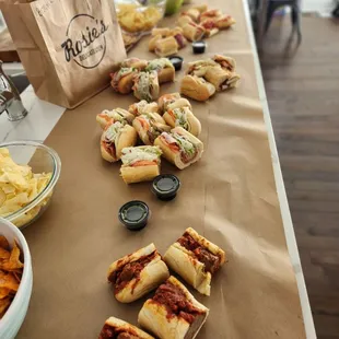 sandwiches and chips on a table